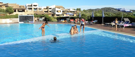Seasonal outdoor pool, pool loungers