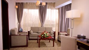 Deluxe Suite Room | Minibar, in-room safe, desk, laptop workspace - Washington Hotel (Addis Ababa)