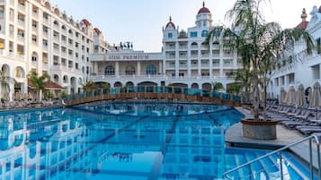Indoor pool, outdoor pool, open 7:00 AM to 7:00 PM, pool umbrellas