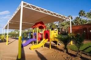 A playground with slides and climbing structures under a white canopy. - Oz Hotels Side Premium (Manavgat)