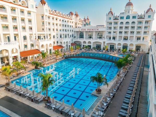 Indoor pool, outdoor pool, open 7:00 AM to 7:00 PM, pool umbrellas