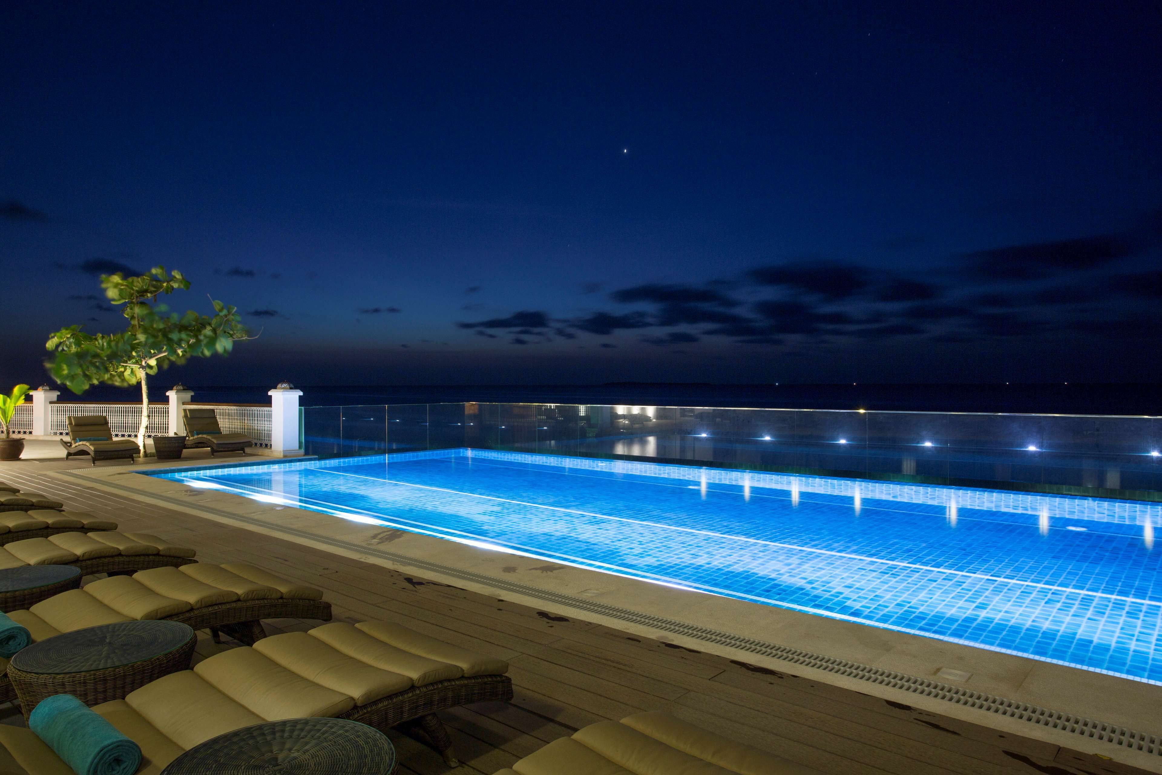 outdoor pool, pool umbrellas, pool loungers