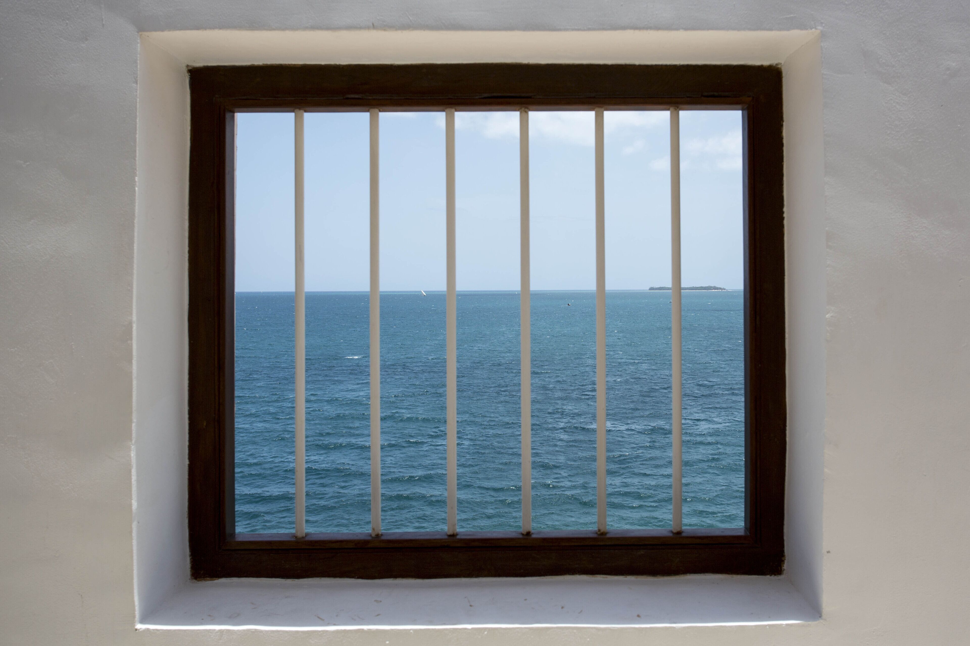 A window with a view of the sea.