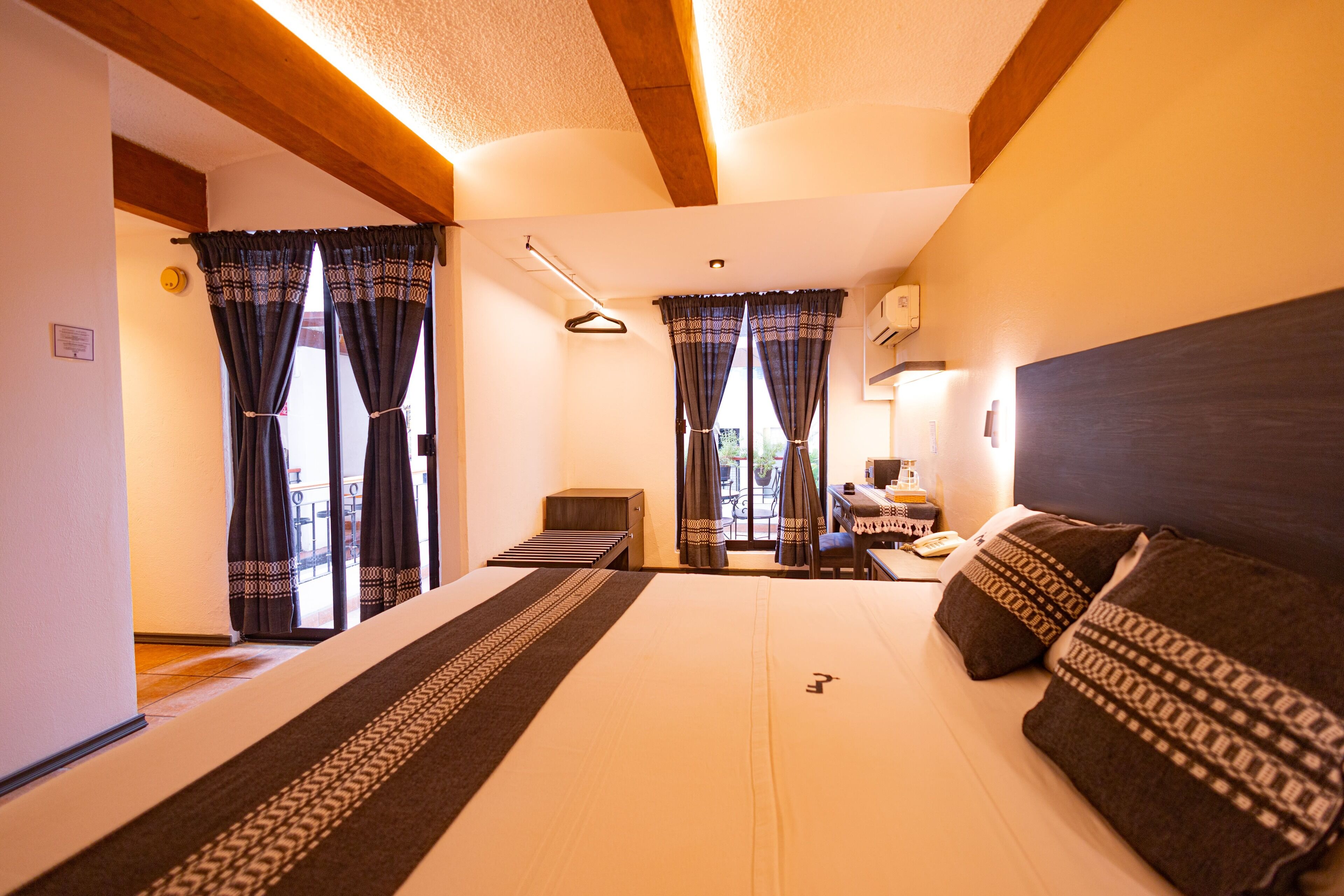 Deluxe Room, 1 King Bed | Iron/ironing board, free WiFi, bed sheets