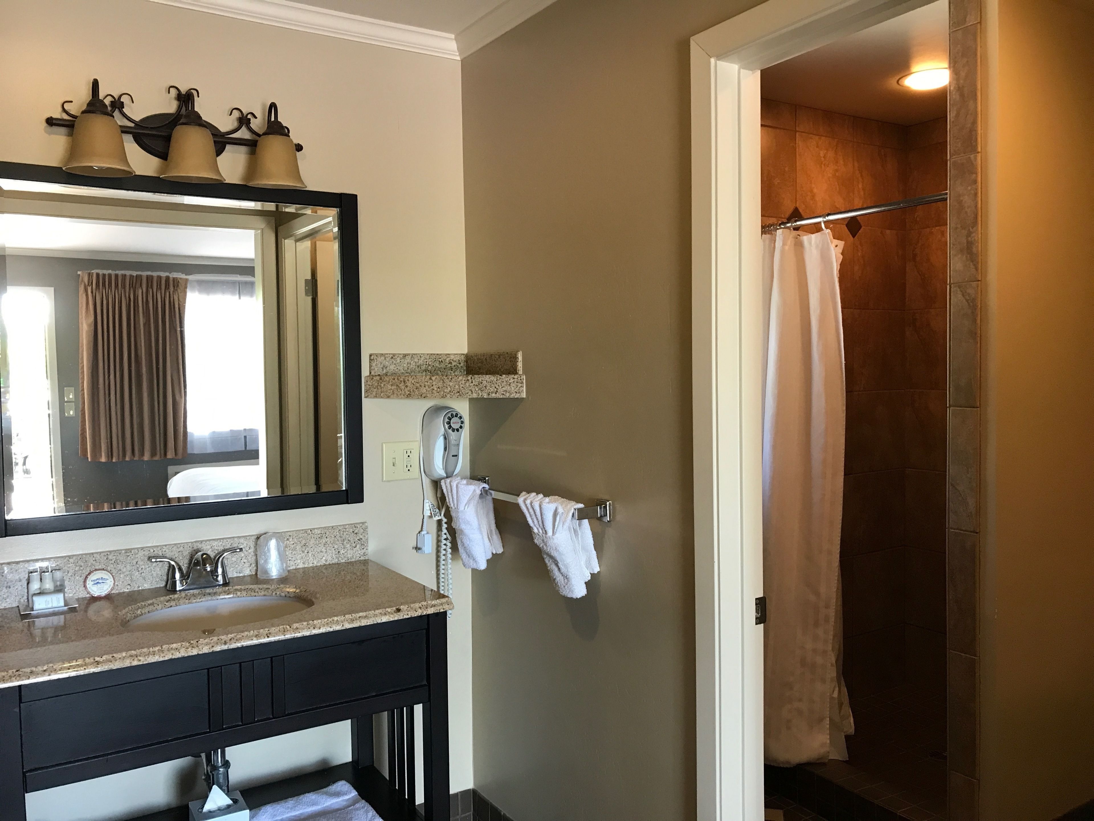 standard room, 1 king bed | bathroom | designer toiletries, hair dryer, bathrobes, towels