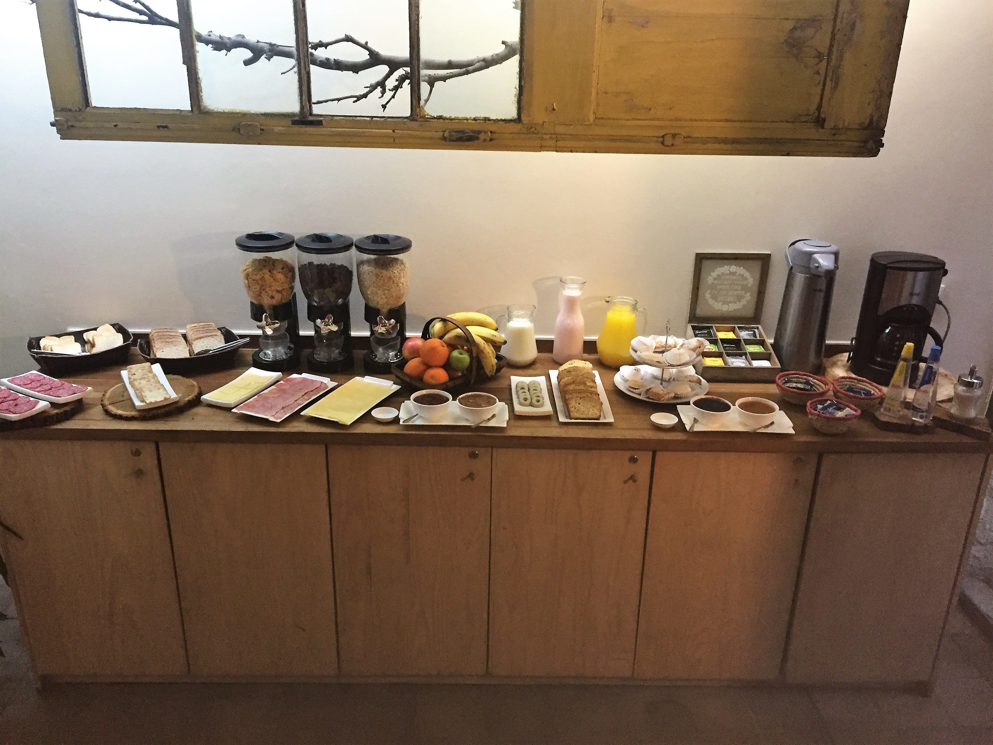 A breakfast buffet with various food items and beverages.