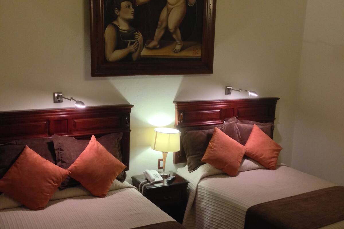 standard double room, 2 double beds | desk, laptop workspace, blackout curtains, iron/ironing board