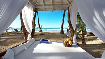 On the beach, white sand, free beach cabanas, sun-loungers