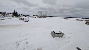 Surrounded by a serene winter landscape, this open area offers a peaceful escape.