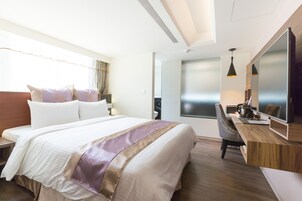 Standard Double Room | Minibar, in-room safe, desk, blackout drapes