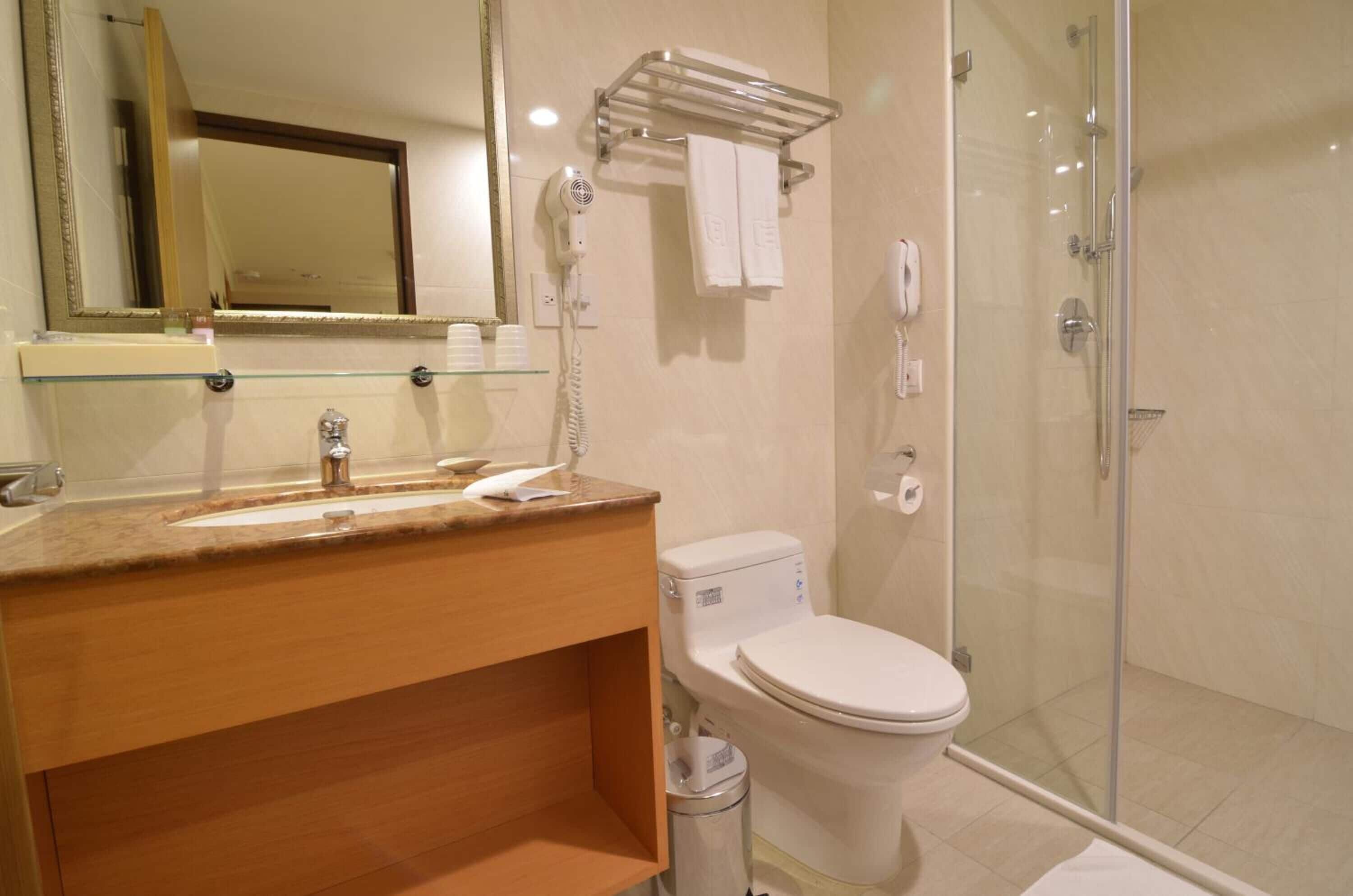 hair dryer, slippers, electronic bidet, towels