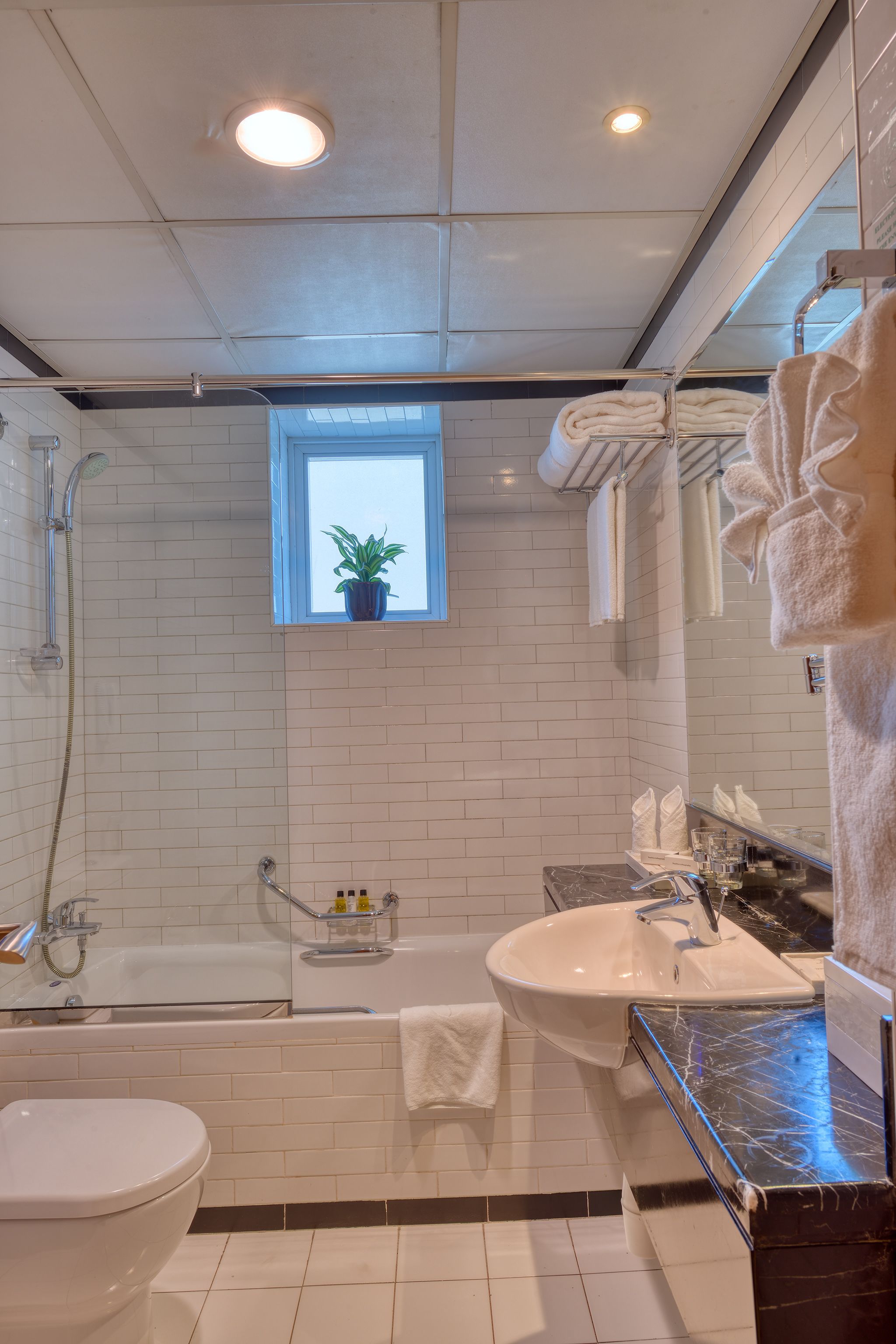 two-bedroom deluxe city view apartment with free beach transfer and 15% f&b discount. | bathroom | bathtub, free toiletries, hair dryer, bathrobes