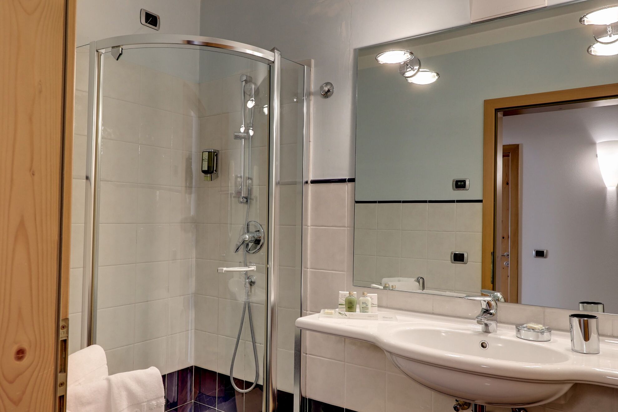 junior suite | bathroom | shower, designer toiletries, hair dryer, slippers