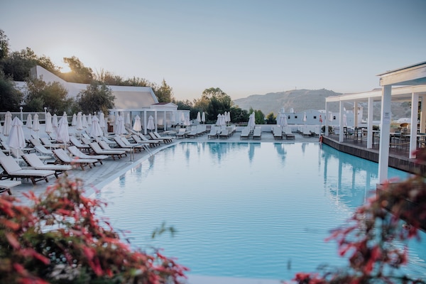 Indoor pool, outdoor pool, open 10:00 AM to 6:00 PM, pool umbrellas