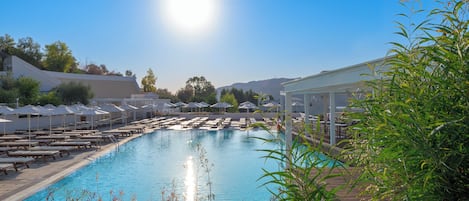 Indoor pool, outdoor pool, open 10:00 AM to 7:00 PM, pool umbrellas