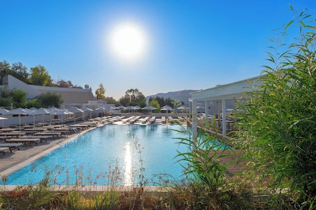 Indoor pool, outdoor pool, open 10:00 AM to 7:00 PM, pool umbrellas