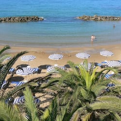 On the beach, sun-loungers, beach umbrellas, beach towels