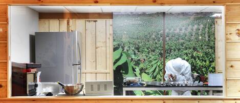 A kitchen area with a sign reading "Craft Chocolate Works".