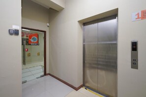 Ride to your destination in style with a convenient elevator featuring a control panel and floor display.