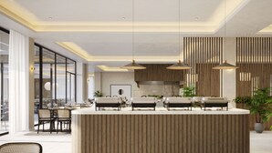 A modern hotel lobby with a central reception desk, seating area, and large windows. - Hotel Labineca (Gradac)