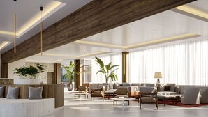 A spacious living area with a high ceiling, wooden beams, and large windows. There are multiple seating arrangements and a bar area visible. - Hotel Labineca (Gradac)