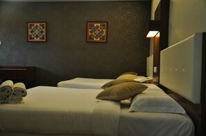 Family Room, 2 Queen Beds | In-room safe, desk, iron/ironing board, free WiFi