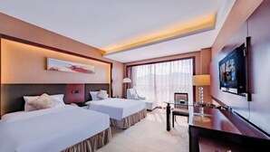 A hotel room with two beds, a desk, a TV, and a window with curtains. - Kunming Dingyi Hotel (Haiyuan Road Xicheng Times Square Branch) (Kunming)