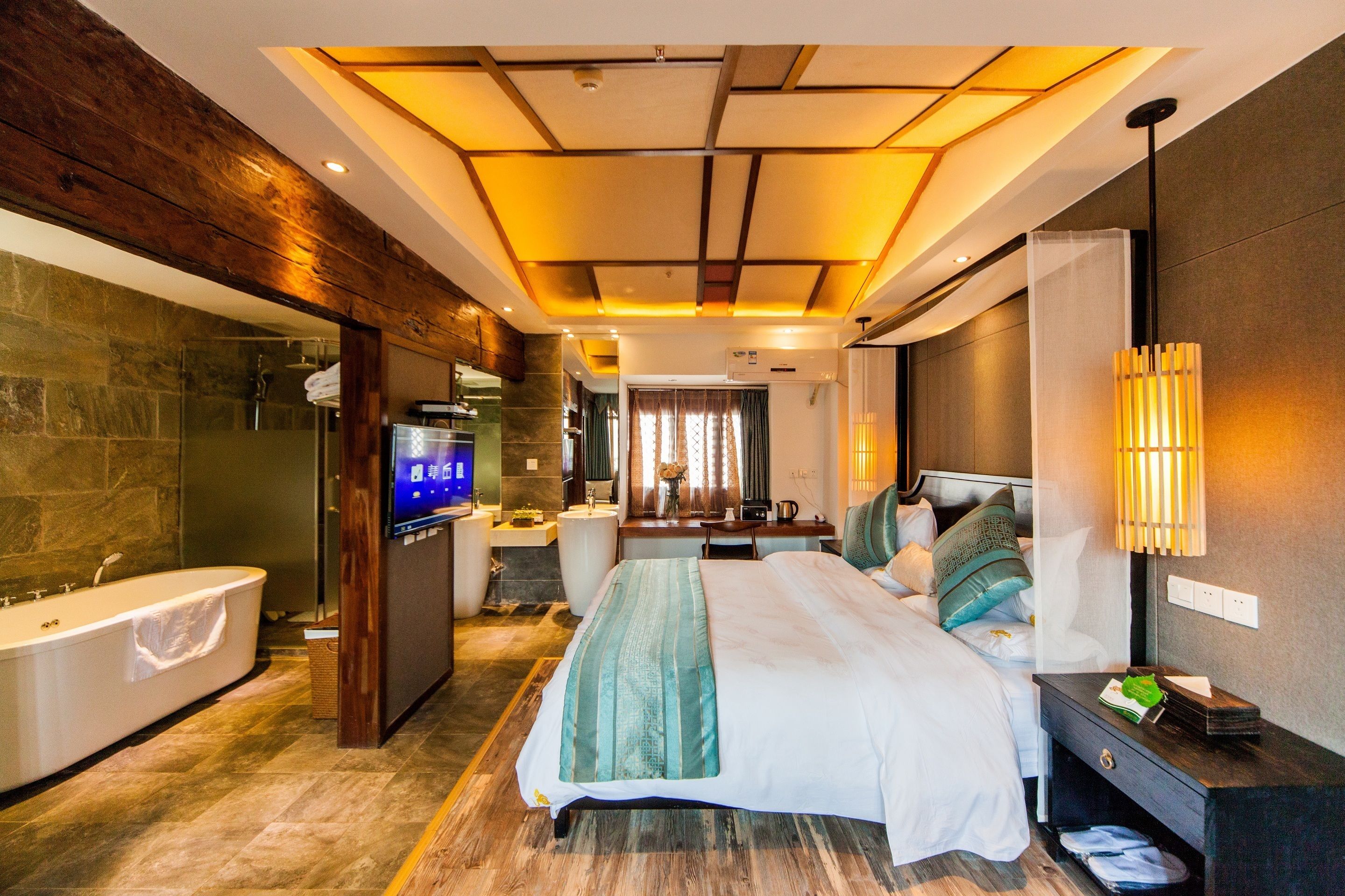 deluxe king room with garden view | premium bedding, desk, blackout curtains, soundproofing