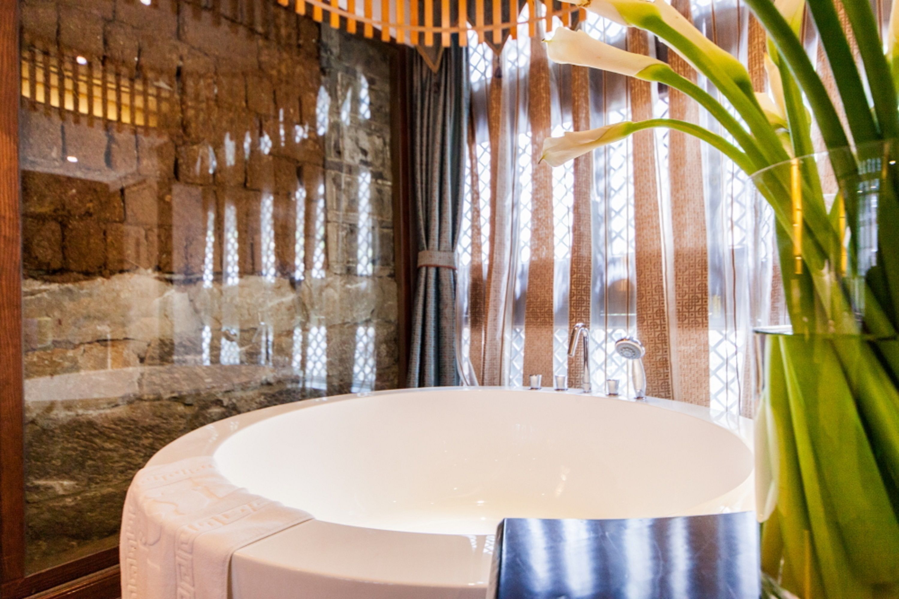 suite with garden view | premium bedding, desk, blackout curtains, soundproofing