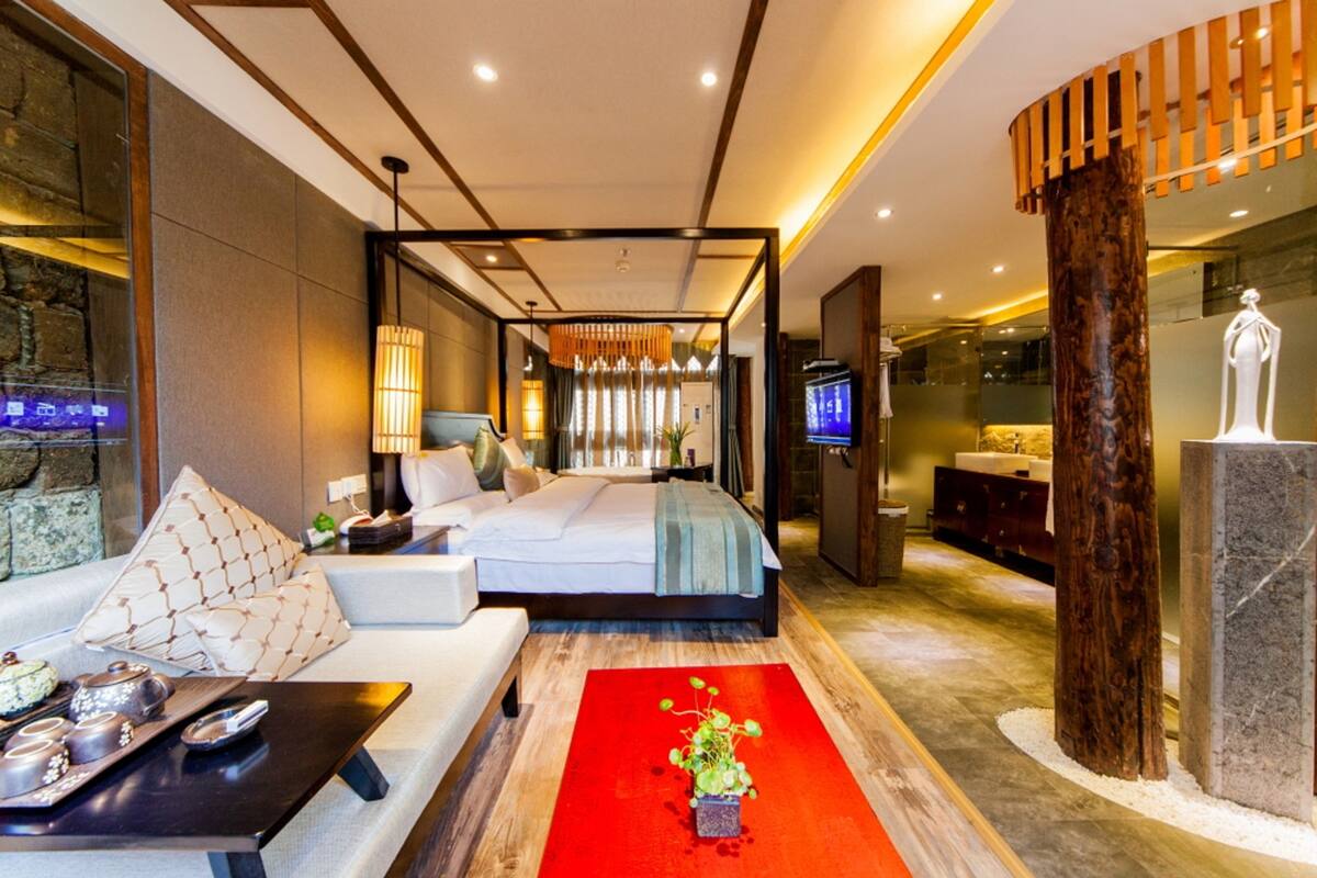 suite with garden view | premium bedding, desk, blackout curtains, soundproofing