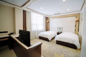 A hotel room with a desk, two beds, a TV, and a large window with curtains. - Run Zeng Hotel (Dandong)