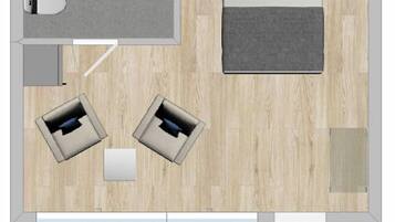 A hotel room layout with a bed, two sofas, a small table, a desk, a bathroom, and a window.
