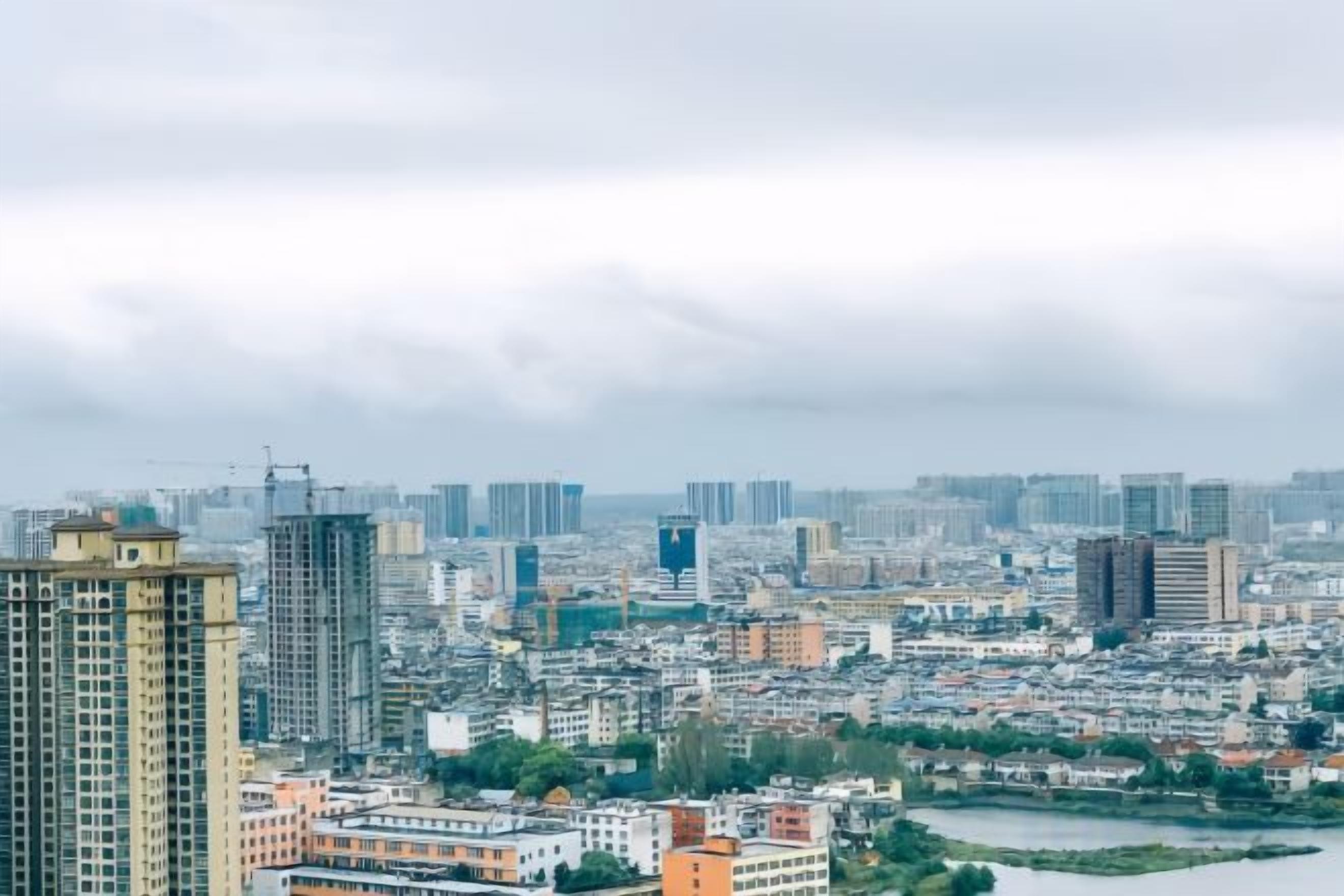 A cityscape with high-rise buildings and a river.