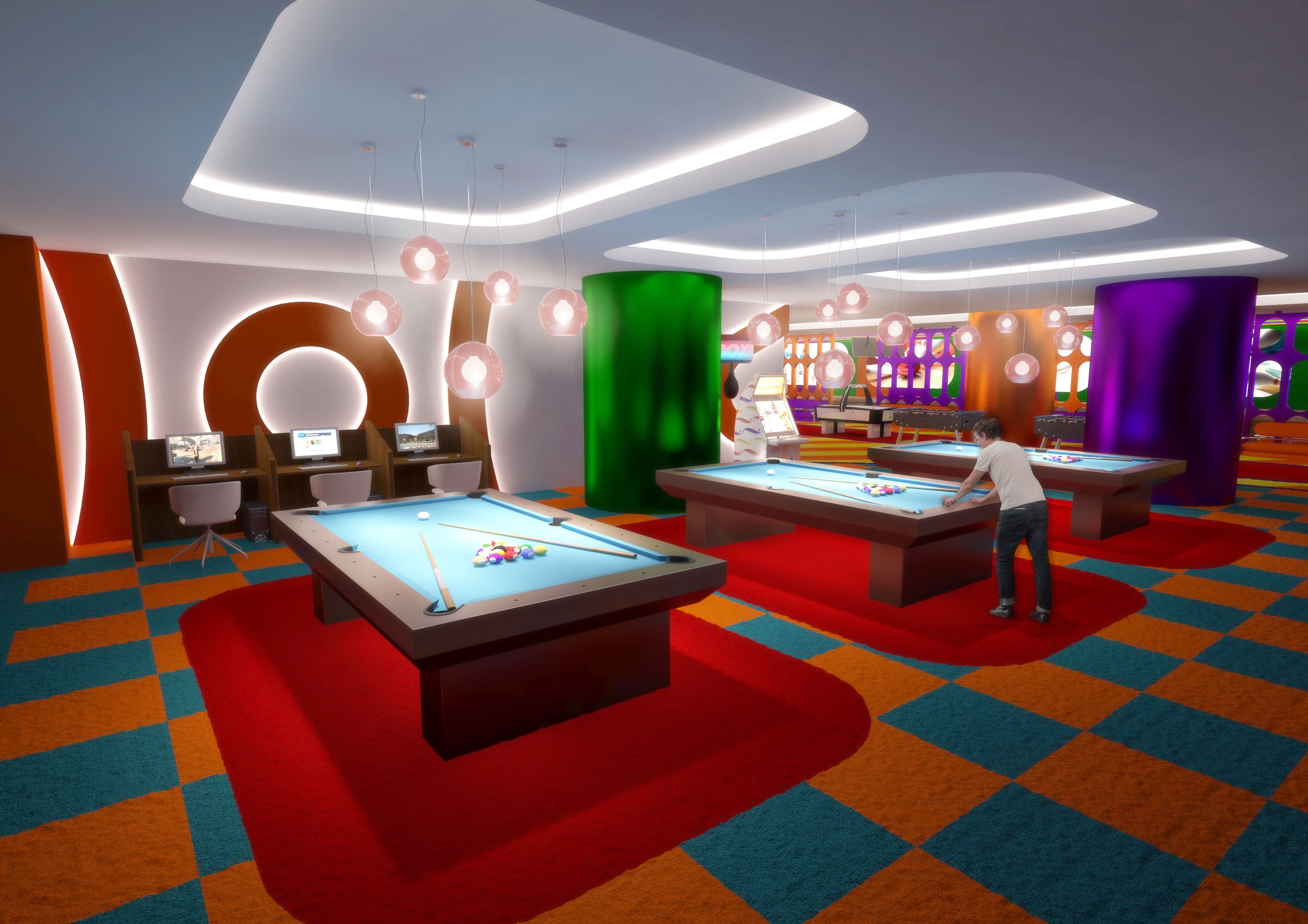 Un espace de loisirs intérieur moderne, doté de tables de billard, d’ordinateurs et d’une décoration dynamique.