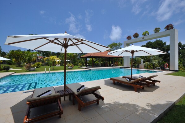 Indoor pool, outdoor pool, free pool cabanas, pool umbrellas