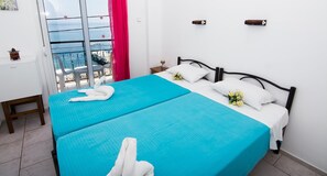 Double Room, Sea View | Desk, iron/ironing board, free cribs/infant beds, rollaway beds