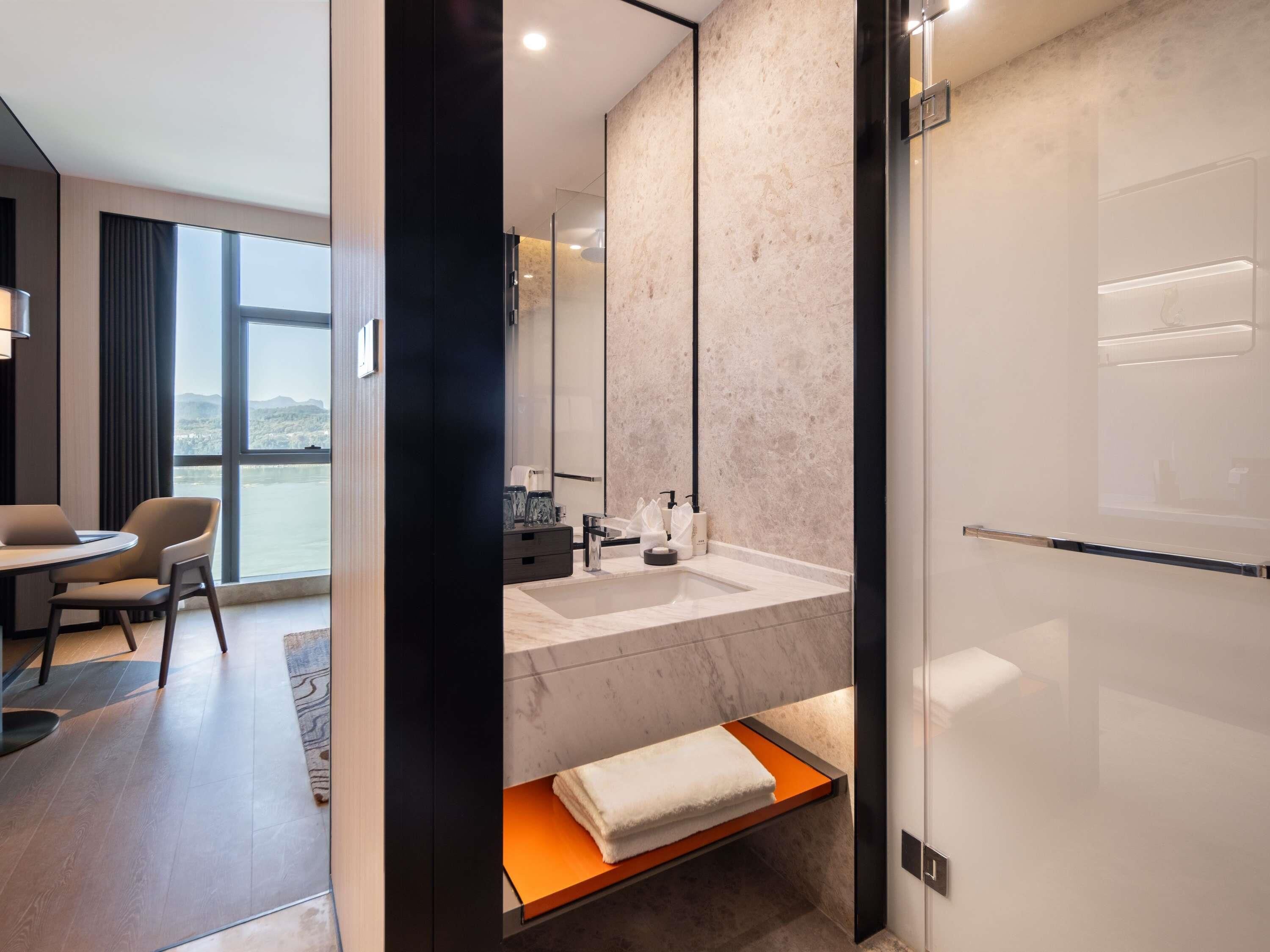 Deluxe Room, 1 King Bed, River View | Down comforters, in-room safe, laptop workspace, blackout drapes