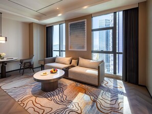 Suite Deluxe, 1 très grand lit | Couette en duvet d'oie, coffres-forts dans les chambres