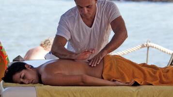 Experience a rejuvenating massage on the beach, with a skilled therapist working to ease tension and soothe the mind.