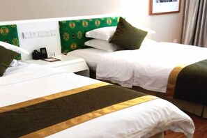 Two single beds with white linens and green headboards, a bedside table with a phone, and a window with curtains. - Xiangxi National Hotel (Xiangxi)