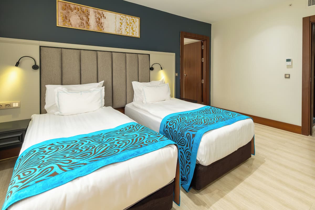 Family Room | Minibar, in-room safe, individually decorated, individually furnished