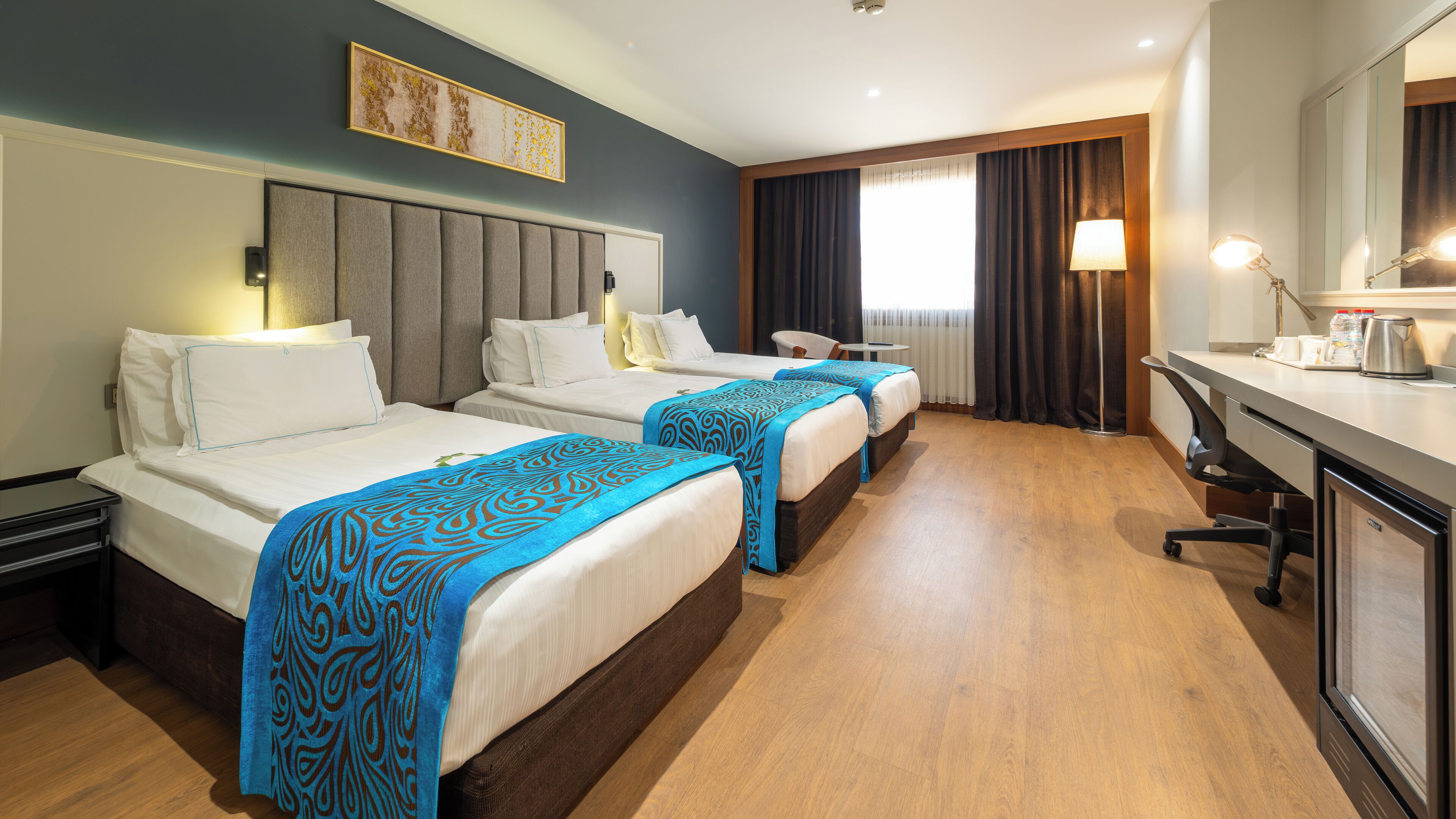 economy triple room | minibar, in-room safe, individually decorated, individually furnished