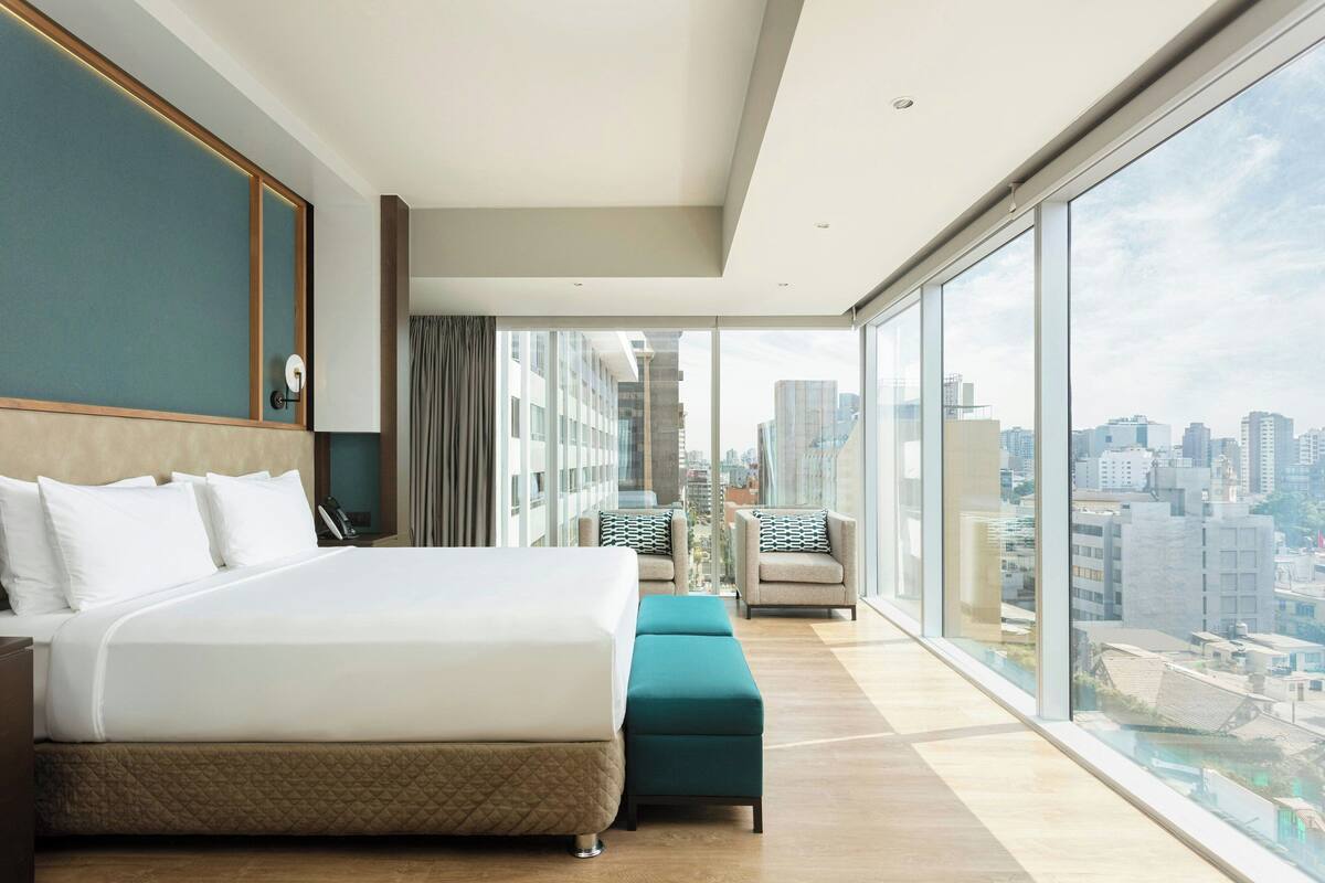 panoramic suite, 1 bedroom, non smoking, city view | 1 bedroom, minibar, in-room safe, desk