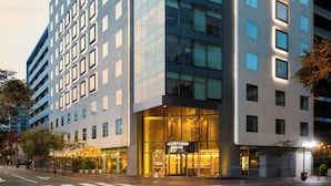 A modern hotel with a glass facade, a courtyard entrance, and a visible sign reading "Courtyard Marriott." - Courtyard by Marriott Lima Miraflores (Lima)