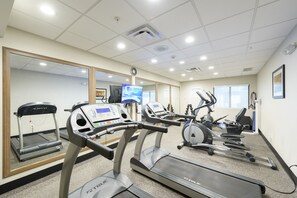 A fitness center with treadmills, ellipticals, and a mirrored wall. - Holiday Inn Express & Suites Jamestown by IHG (Jamestown)