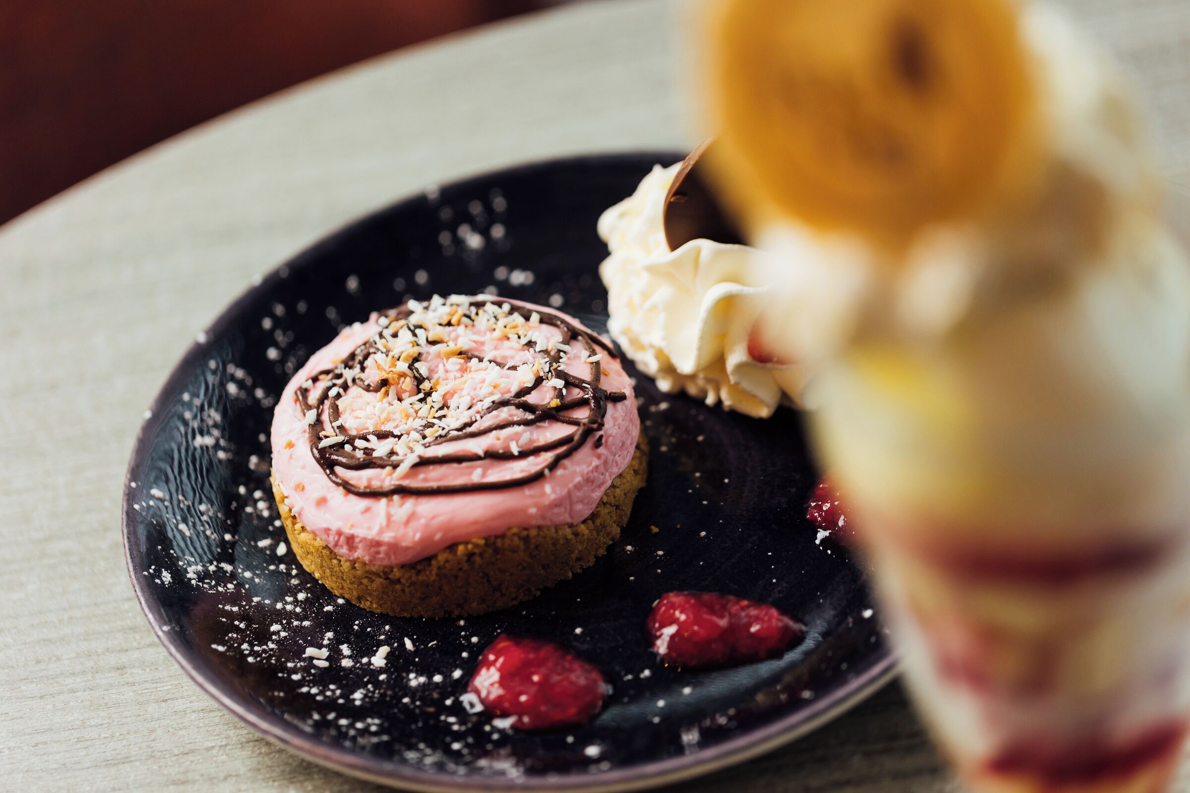 A dessert on a plate with a dark background.