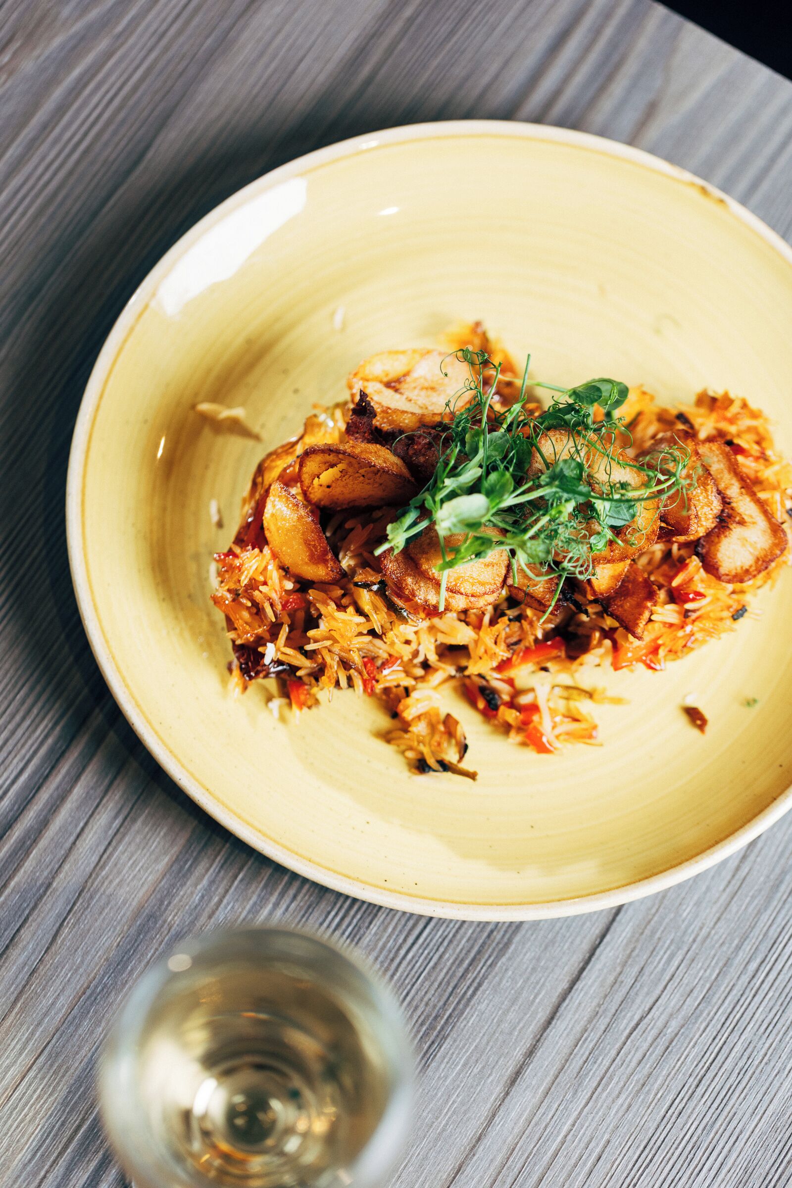 A plate of food on a wooden table.