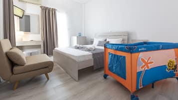 Standard Triple Room | Minibar, desk, laptop workspace, soundproofing