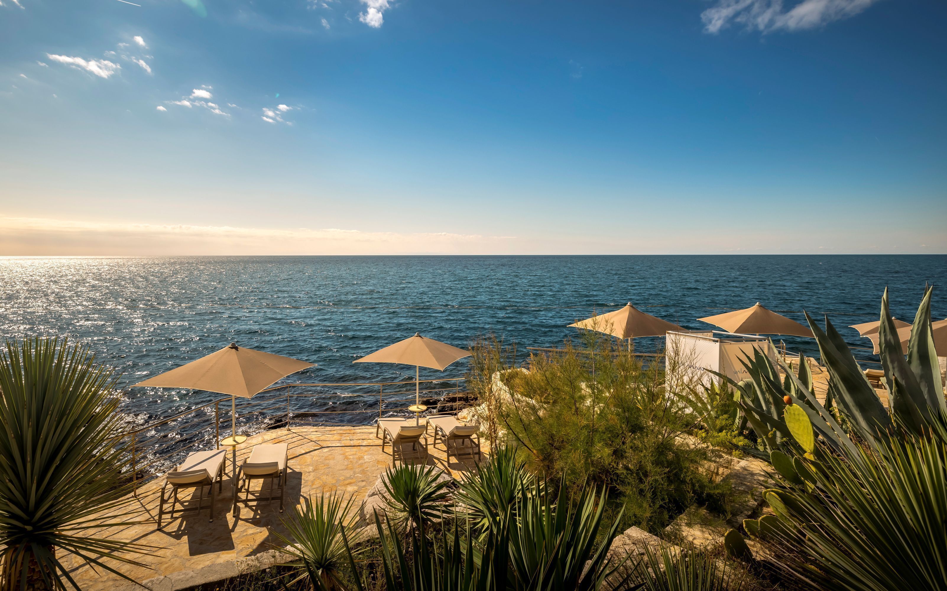 On the beach, sun-loungers, beach umbrellas