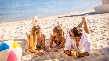 On the beach, sun loungers, beach umbrellas